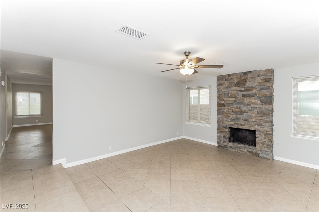 4737 Monaco Road Las Vegas, NV 89121 - Photo 8 of 21 Unfurnished living room featuring ceiling fan, ple