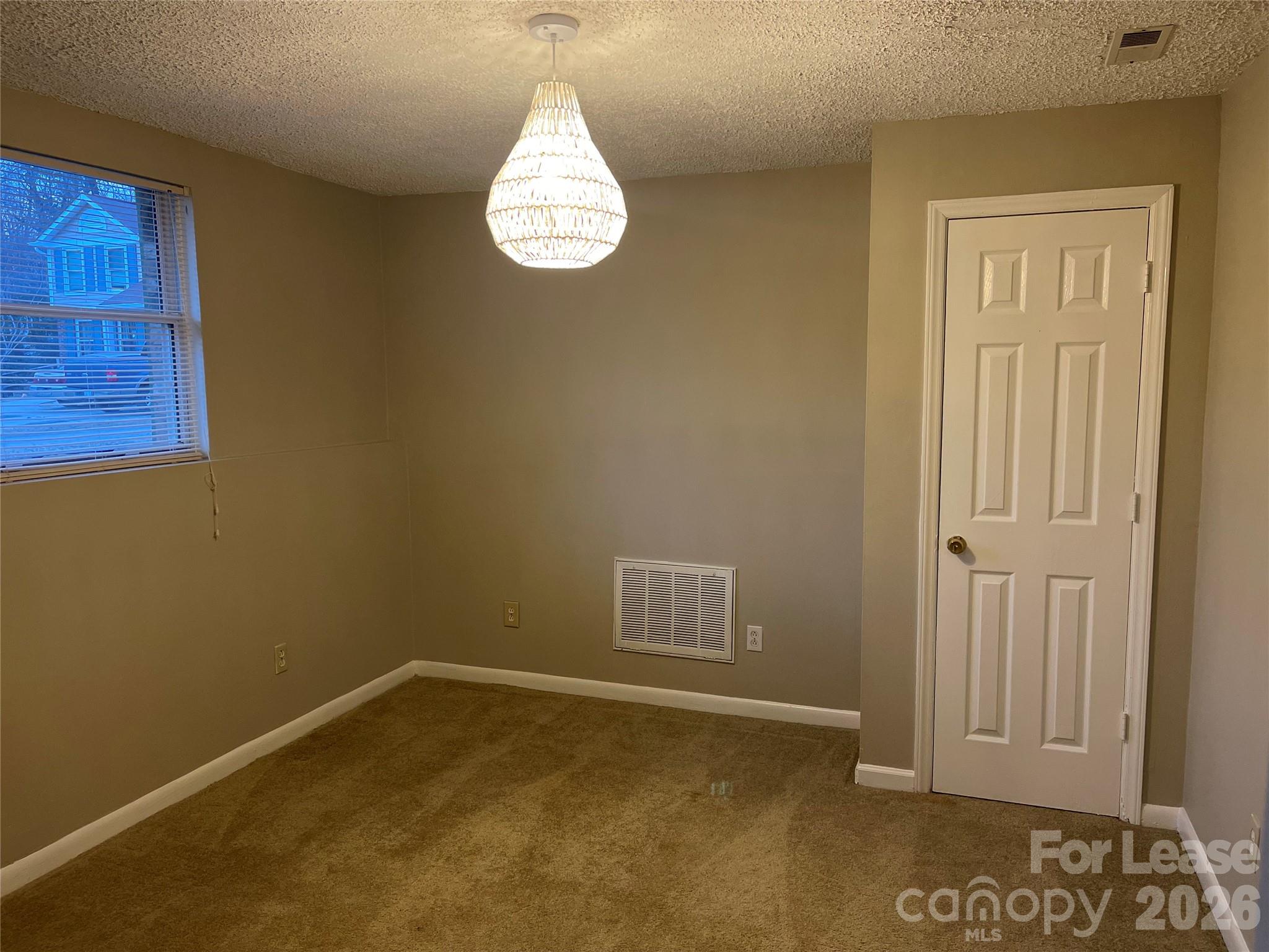 8434 Killian Ridge Court Charlotte, NC 28227 - Photo 13 of 18 a view of empty room with window