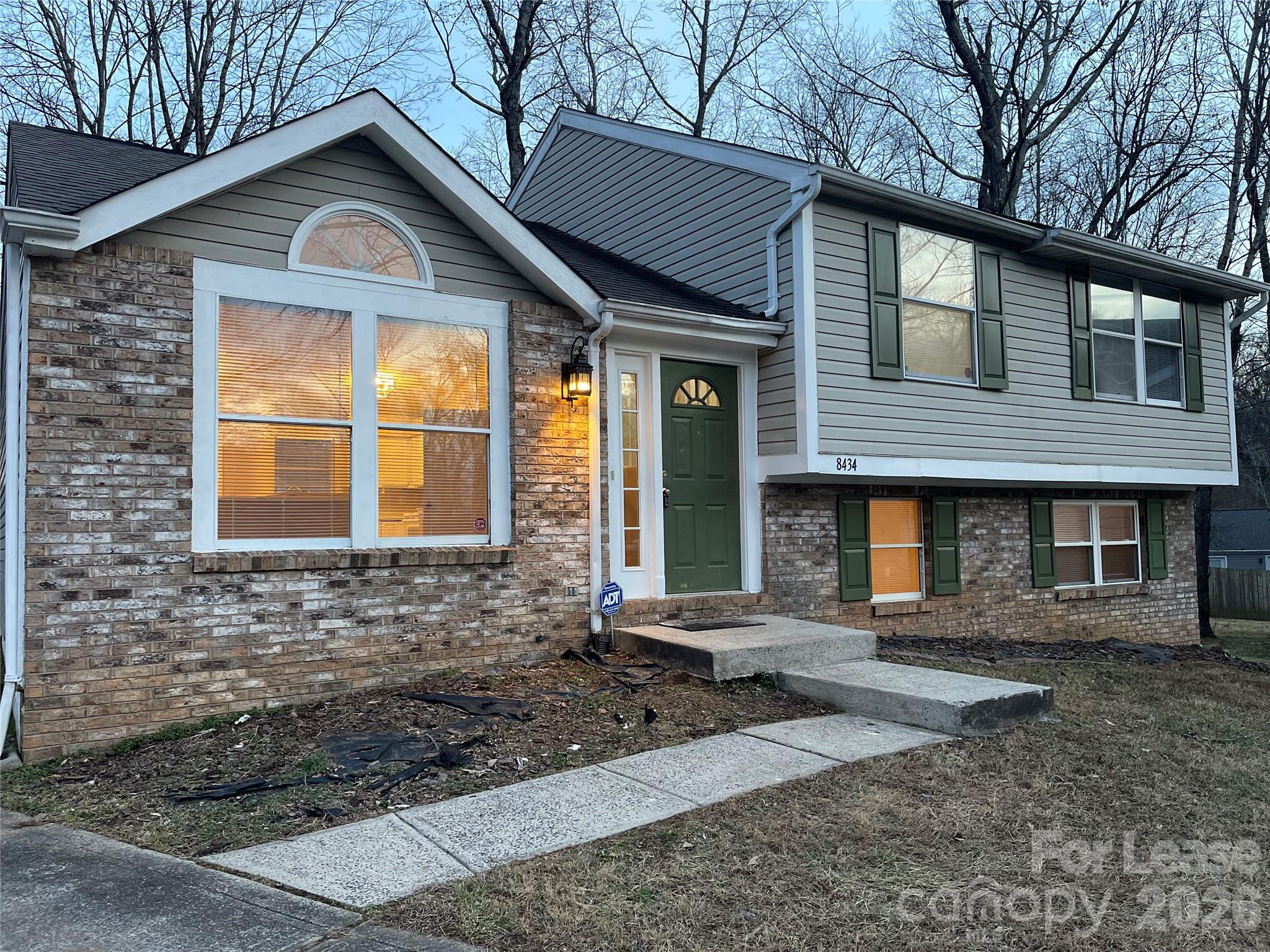 8434 Killian Ridge Court Charlotte, NC 28227 - Photo 2 of 18 a front view of a house with garden
