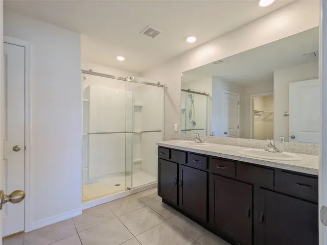 a view of a backyard with swimming pool