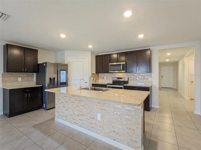 a view of a lake with houses in the background