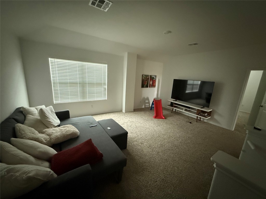 380 Mendoza Kyle, TX 78640 - Photo 20 of 28 a bedroom with furniture and a window