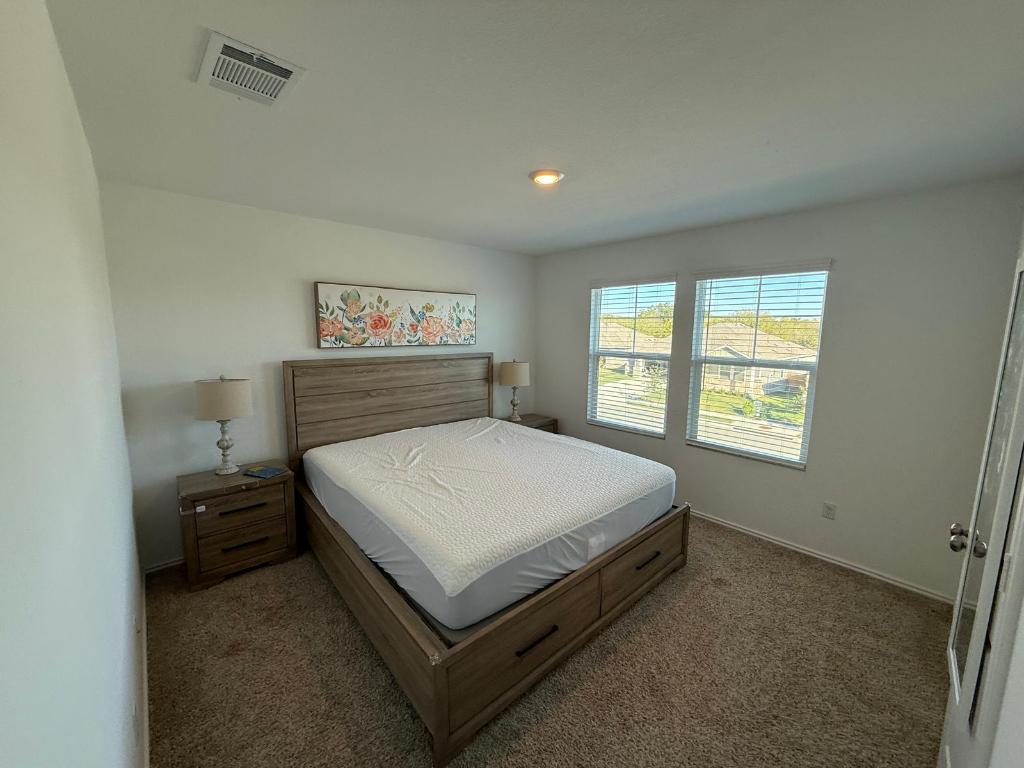 380 Mendoza Kyle, TX 78640 - Photo 22 of 28 a bedroom with a bed and window