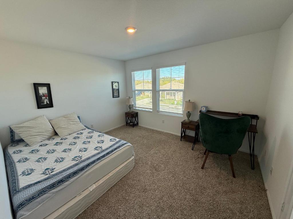 380 Mendoza Kyle, TX 78640 - Photo 23 of 28 a bedroom with a bed and chair