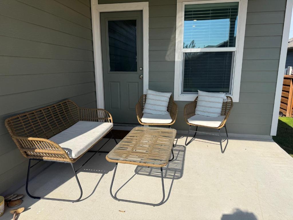 380 Mendoza Kyle, TX 78640 - Photo 26 of 28 a couple of chairs sitting in front of a door