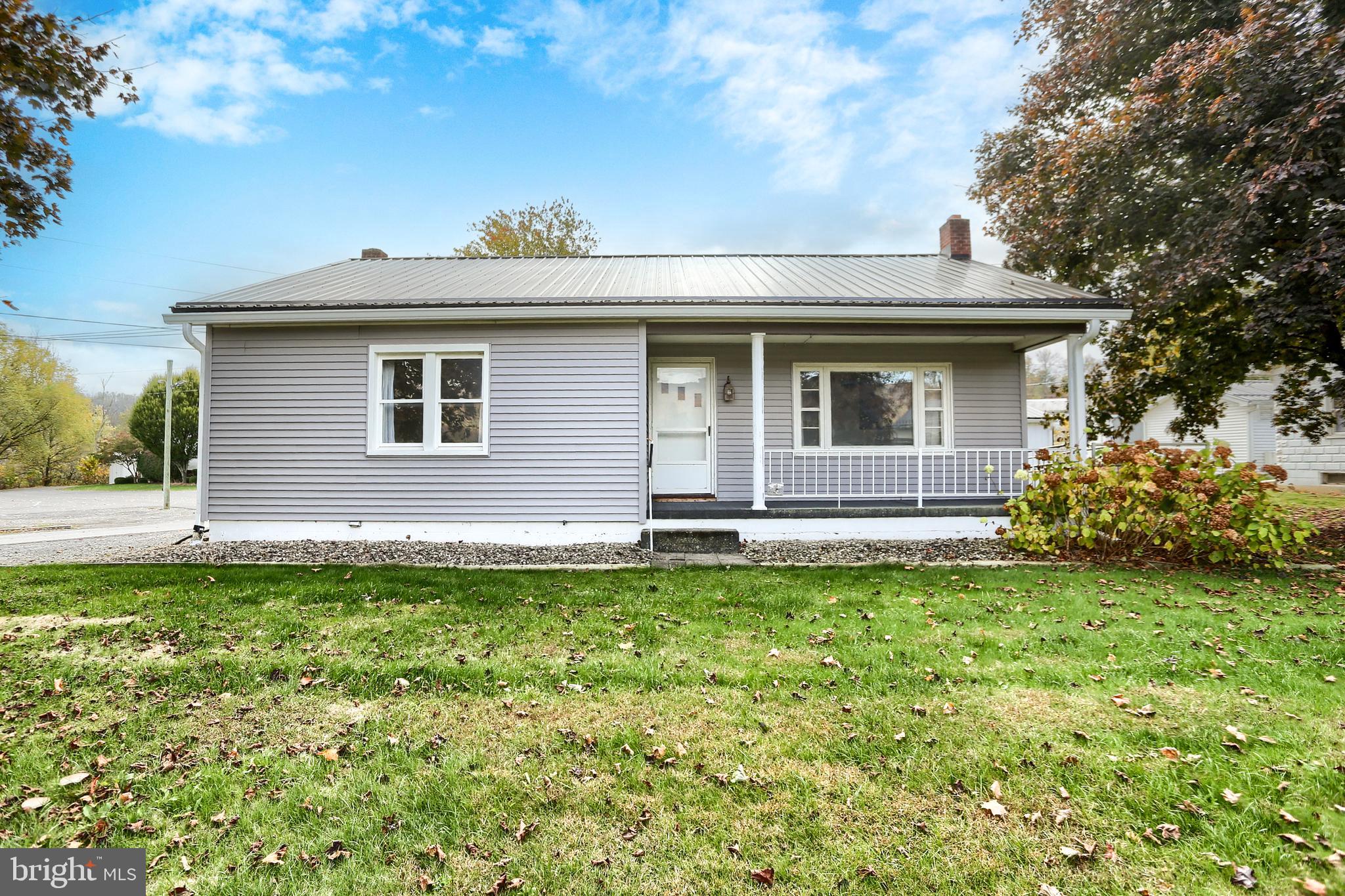 a view of a house with a yard and plants