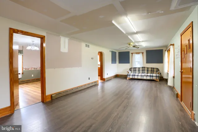 a view of a livingroom with furniture and an entryway
