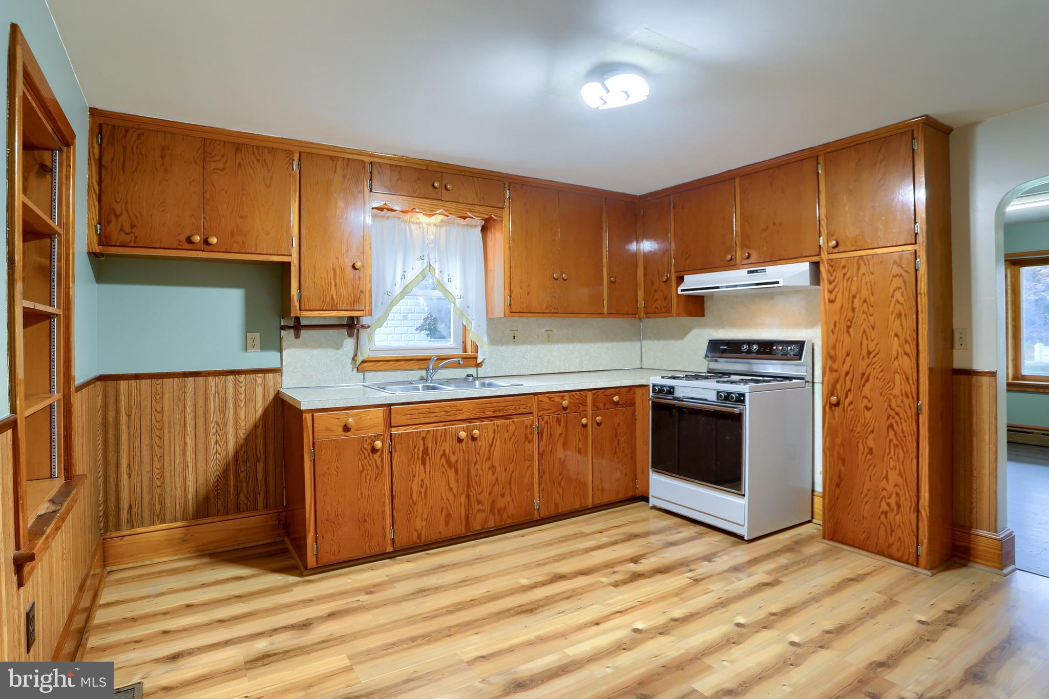 858 Main Street Richfield, PA 17086 - Photo 17 of 29 a kitchen with stainless steel appliances granite countertop a refrigerator sink and cabinets