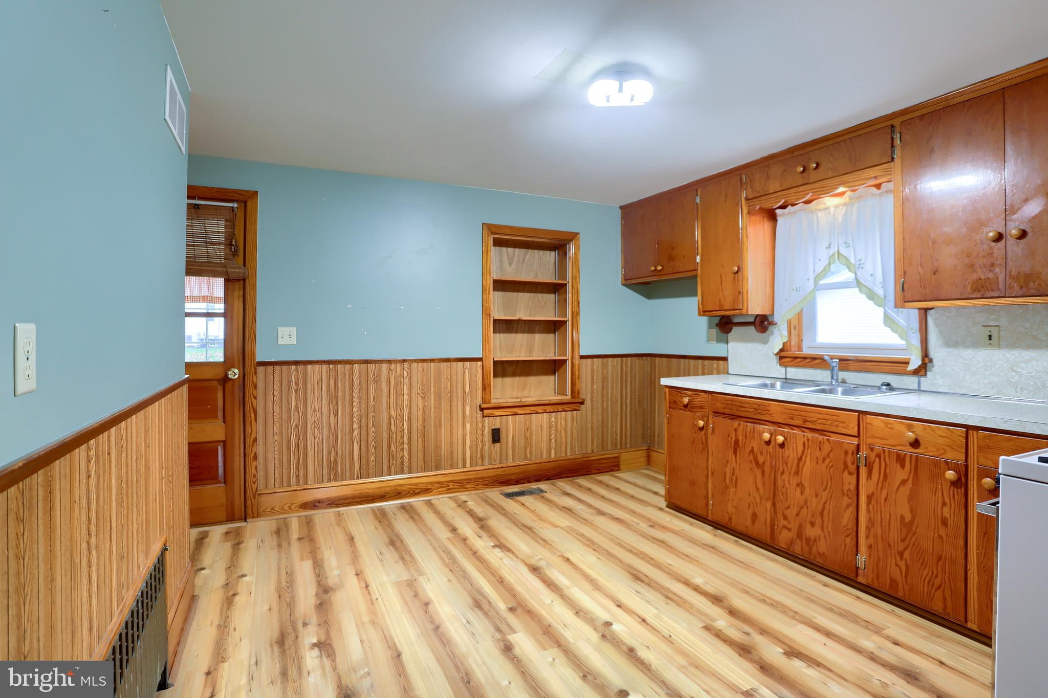 858 Main Street Richfield, PA 17086 - Photo 18 of 29 a kitchen with stainless steel appliances granite countertop a sink stove and cabinets
