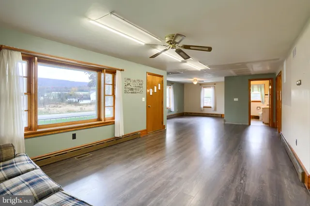 a view of livingroom with furniture wooden floor and window