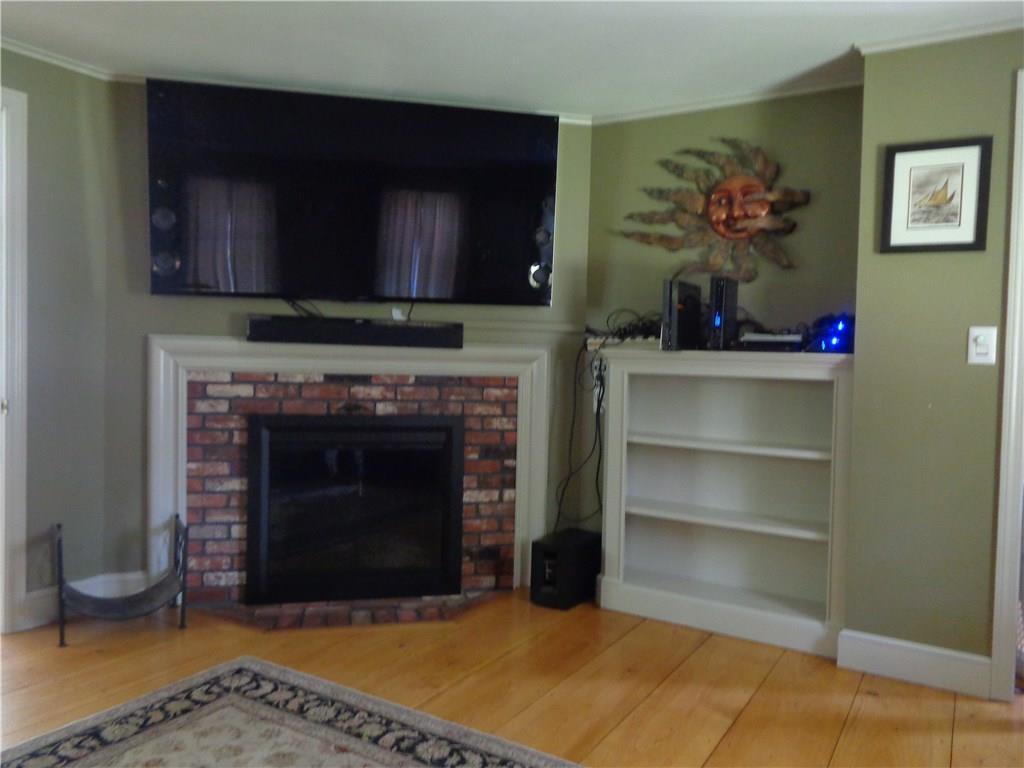 694 Chick Crossing Road Wells, ME 04090 - Photo 10 of 25 Living room with fireplace &...