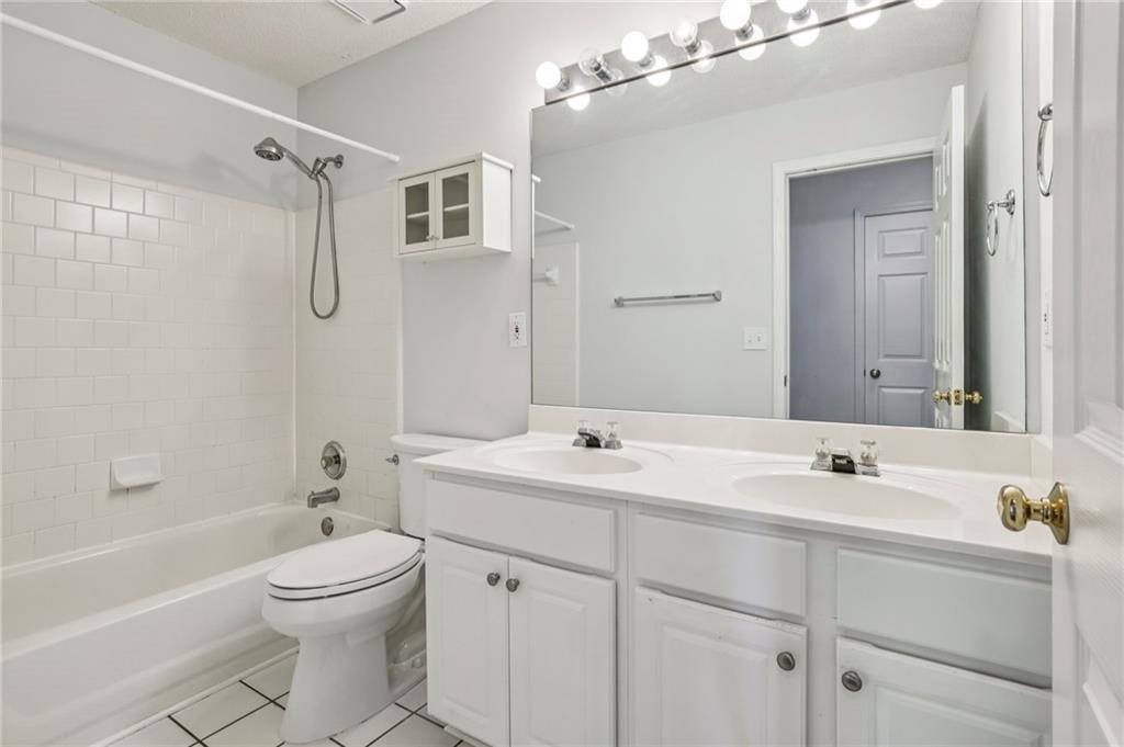 615 Tammany Pointe Alpharetta, GA 30004 - Photo 11 of 15 a bathroom with a sink a toilet and shower