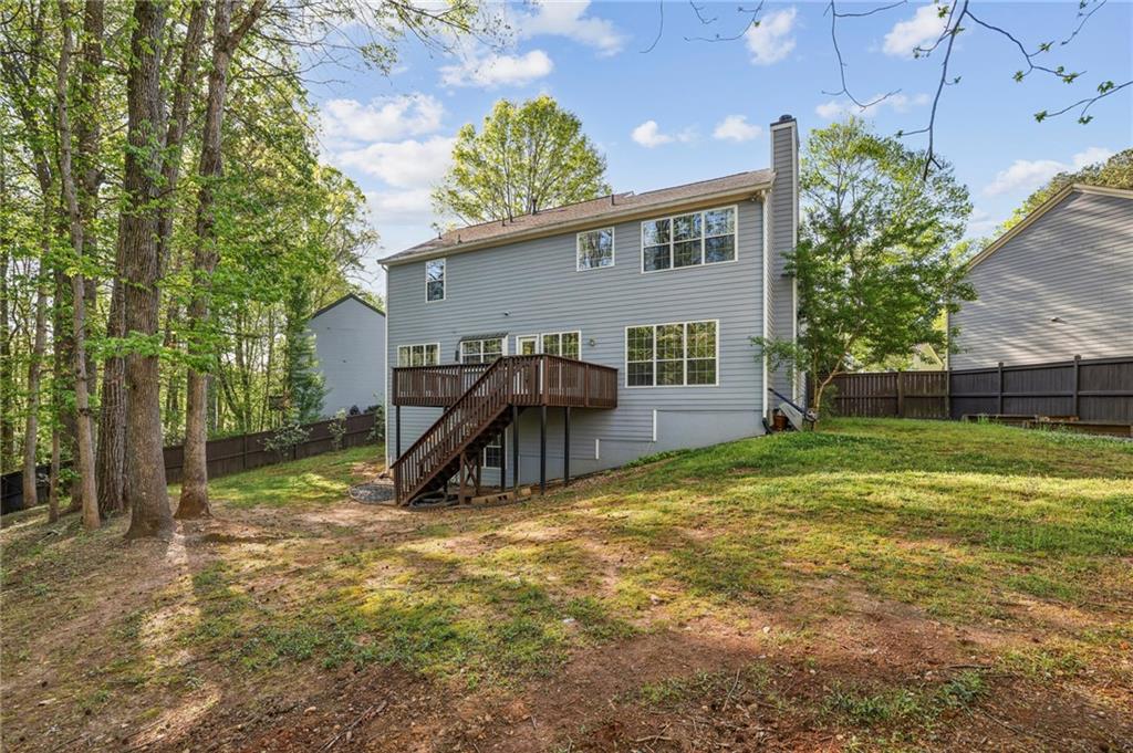 615 Tammany Pointe Alpharetta, GA 30004 - Photo 13 of 15 a view of a house with backyard and sitting area