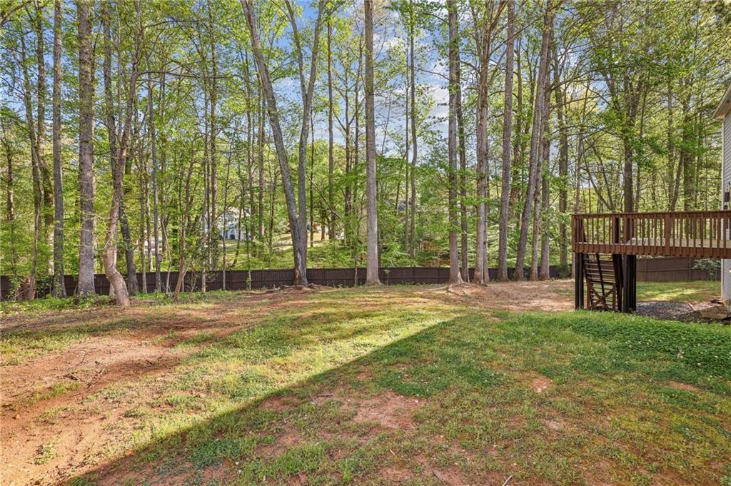 615 Tammany Pointe Alpharetta, GA 30004 - Photo 14 of 15 a swimming pool with outdoor seating and yard
