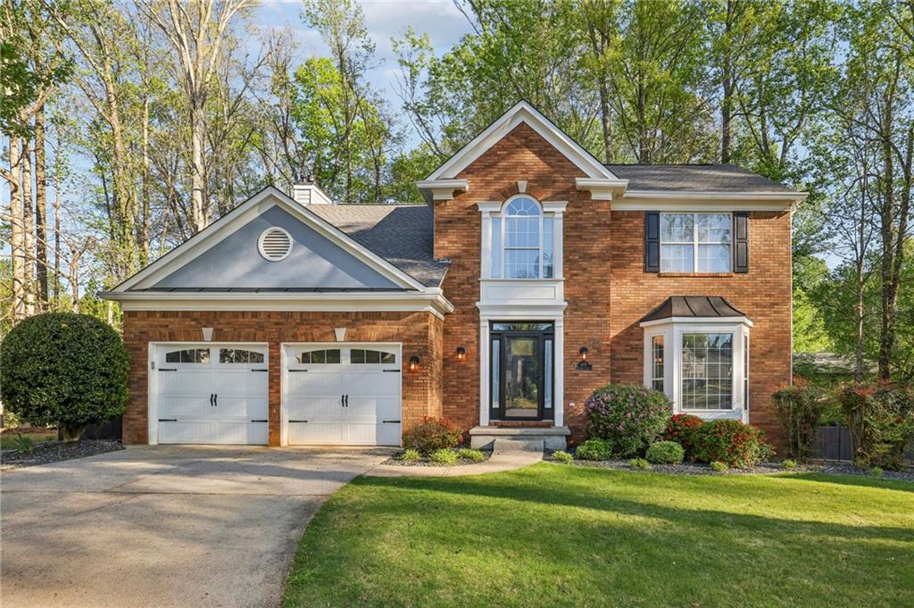 615 Tammany Pointe Alpharetta, GA 30004 - Photo 15 of 15 front view of a house with a yard