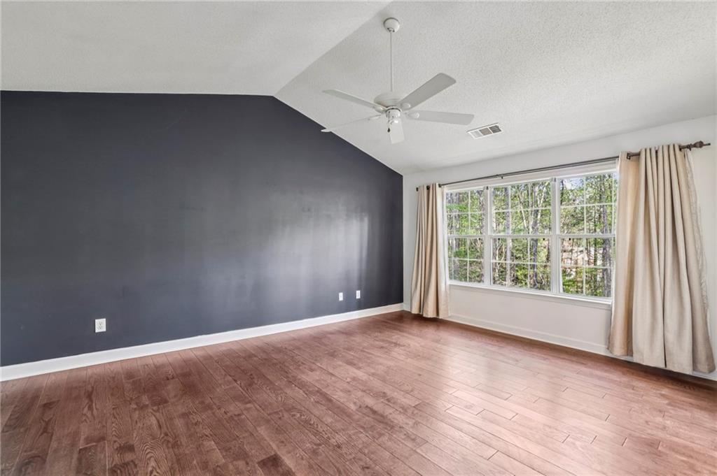 615 Tammany Pointe Alpharetta, GA 30004 - Photo 5 of 15 an empty room with wooden floor and windows