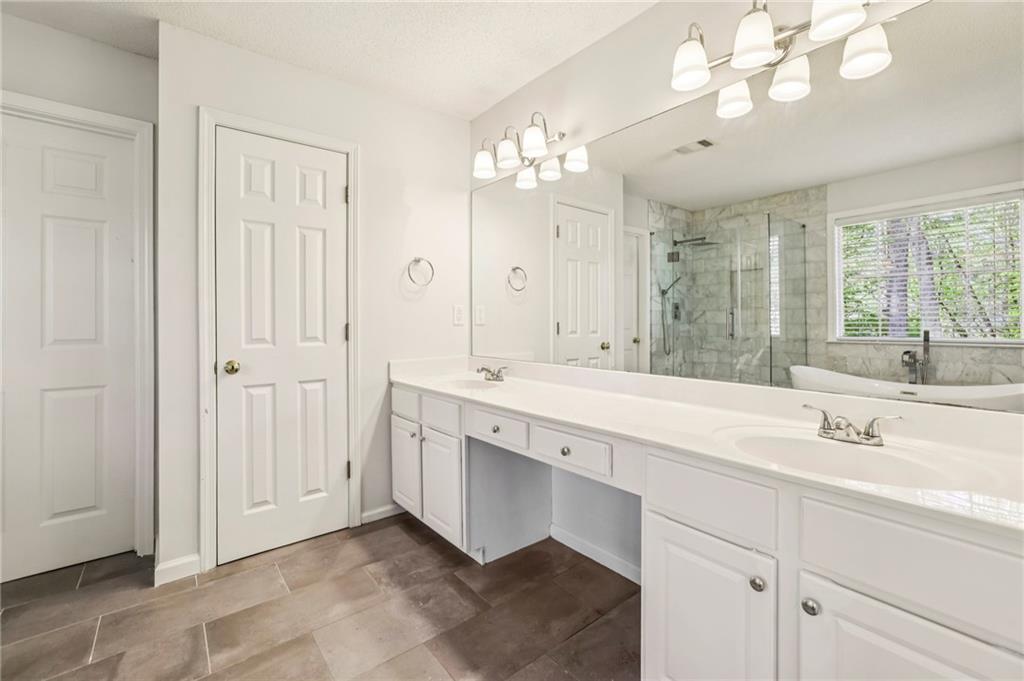 615 Tammany Pointe Alpharetta, GA 30004 - Photo 6 of 15 a bathroom with a sink vanity and a mirror