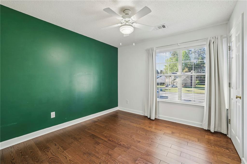 615 Tammany Pointe Alpharetta, GA 30004 - Photo 9 of 15 an empty room with a window and a ceiling fan
