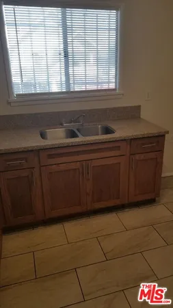 a kitchen with a sink and a window