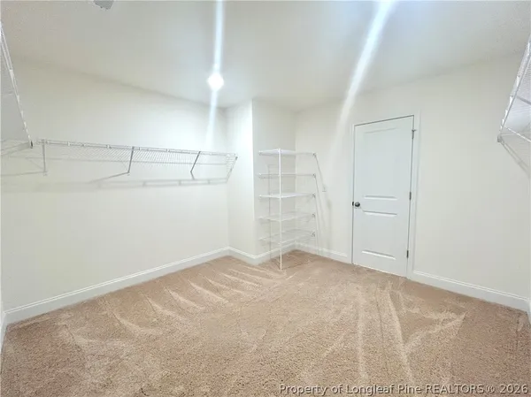 an empty room with shelves