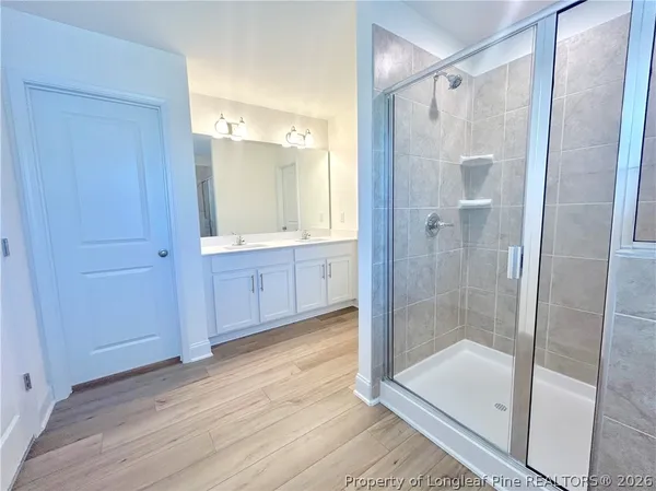 a bathroom with a glass shower door