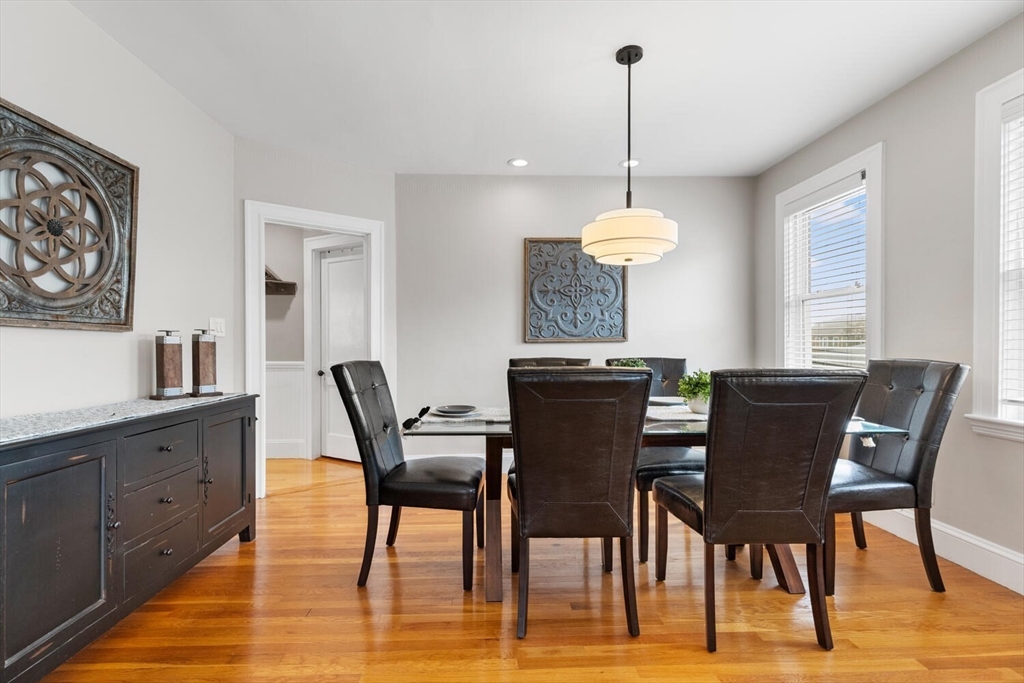 35 Richardson Street, Unit 2 Wakefield, MA 01880 - Photo 13 of 32 a dining room filled chandelier and wooden floor
