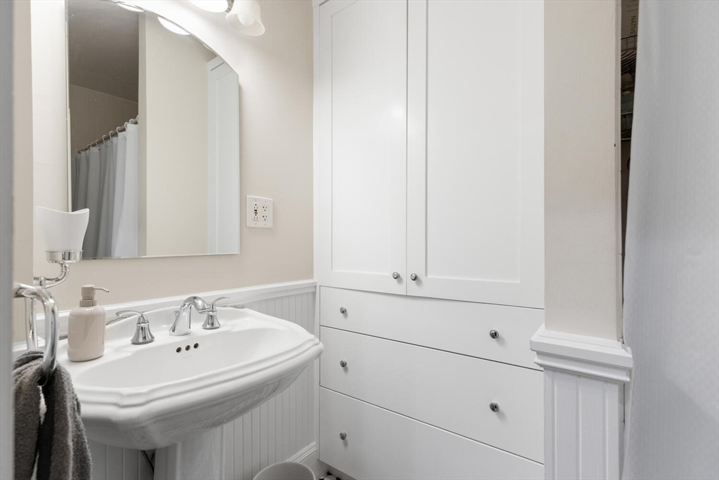 35 Richardson Street, Unit 2 Wakefield, MA 01880 - Photo 24 of 32 a bathroom with a sink and a mirror