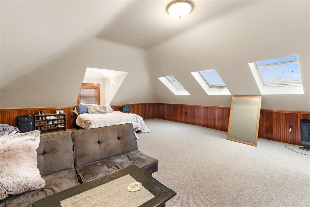 35 Richardson Street, Unit 2 Wakefield, MA 01880 - Photo 28 of 32 a spacious bedroom with a bed and a cabinets