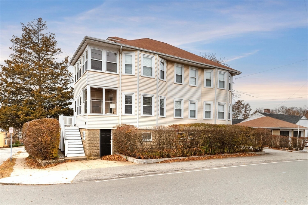 35 Richardson Street, Unit 2 Wakefield, MA 01880 - Photo 5 of 32 a front view of a house with yard and parking