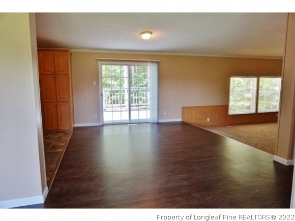 2972 Underwood Road Carthage, NC 28327 - Photo 12 of 24 a view of an empty room with wooden floor and a window