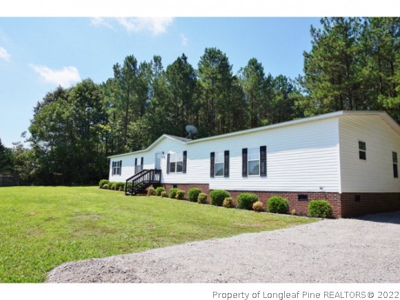 2972 Underwood Road Carthage, NC 28327 - Photo 2 of 24 a house that has a lot of plants in it