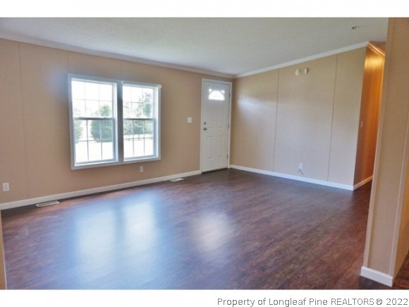 2972 Underwood Road Carthage, NC 28327 - Photo 4 of 24 a view of an empty room with wooden floor and a window