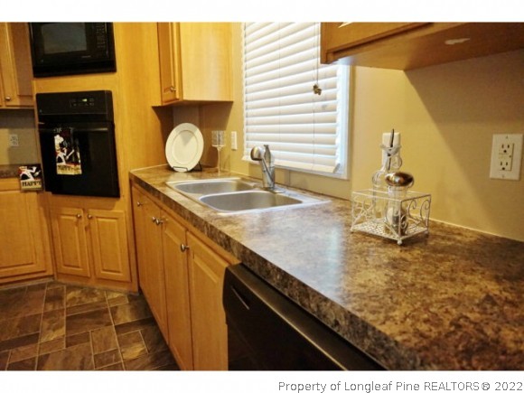 2972 Underwood Road Carthage, NC 28327 - Photo 6 of 24 a kitchen with sink and cabinets