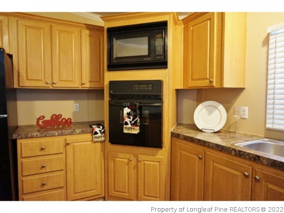 2972 Underwood Road Carthage, NC 28327 - Photo 7 of 24 a kitchen with stainless steel appliances granite countertop a stove a sink and dishwasher