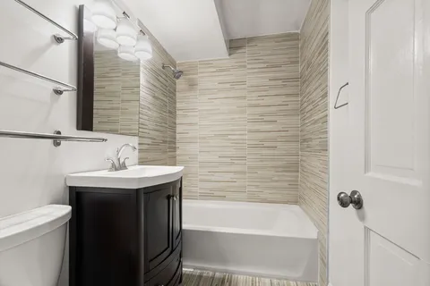 a bathroom with a sink and bathtub