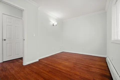 an empty room with wooden floor