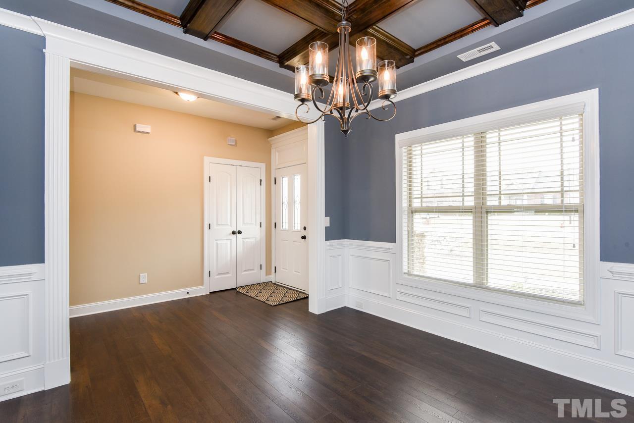 43 Sharpstone Lane Clayton, NC 27527 - Photo 12 of 39 a view of an empty room with wooden floor and a window
