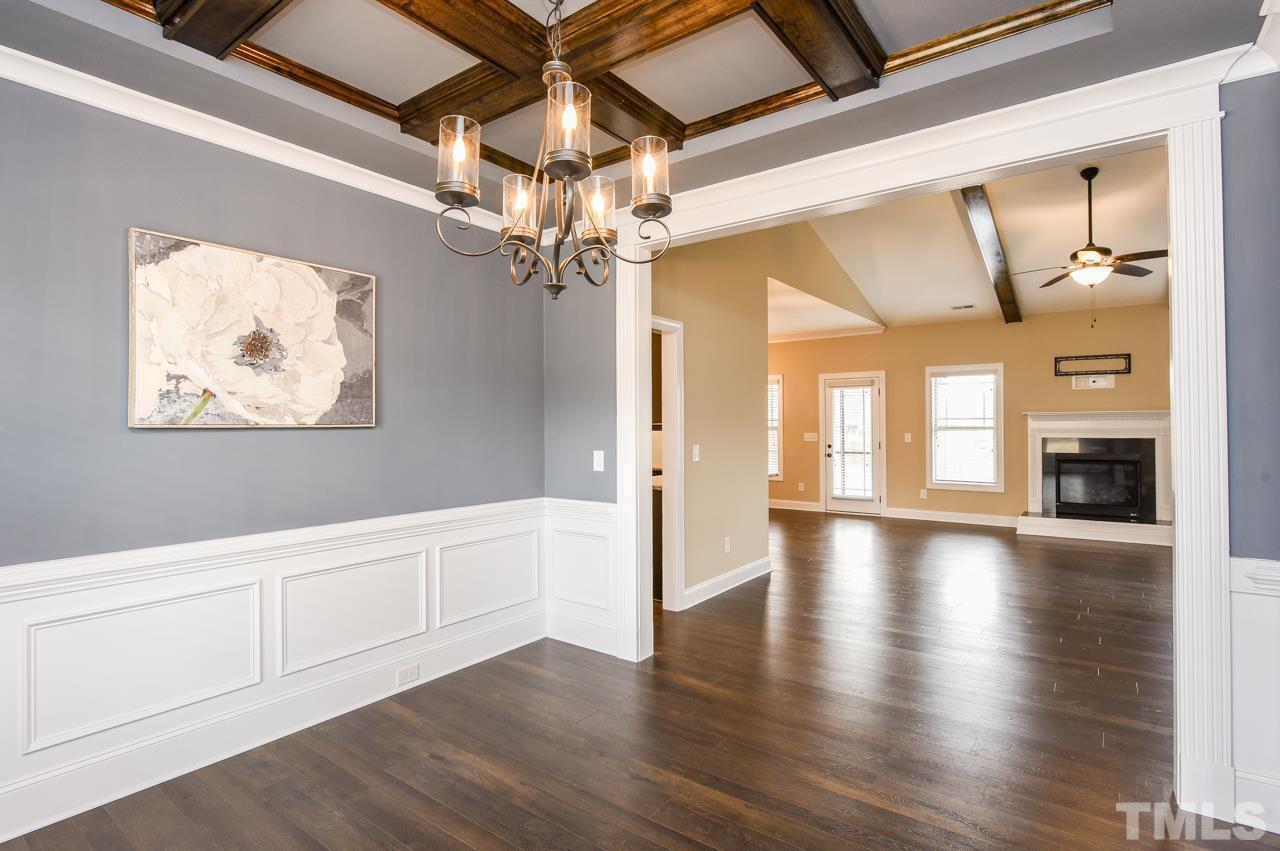 43 Sharpstone Lane Clayton, NC 27527 - Photo 14 of 39 a view of an empty room with wooden floor and a window