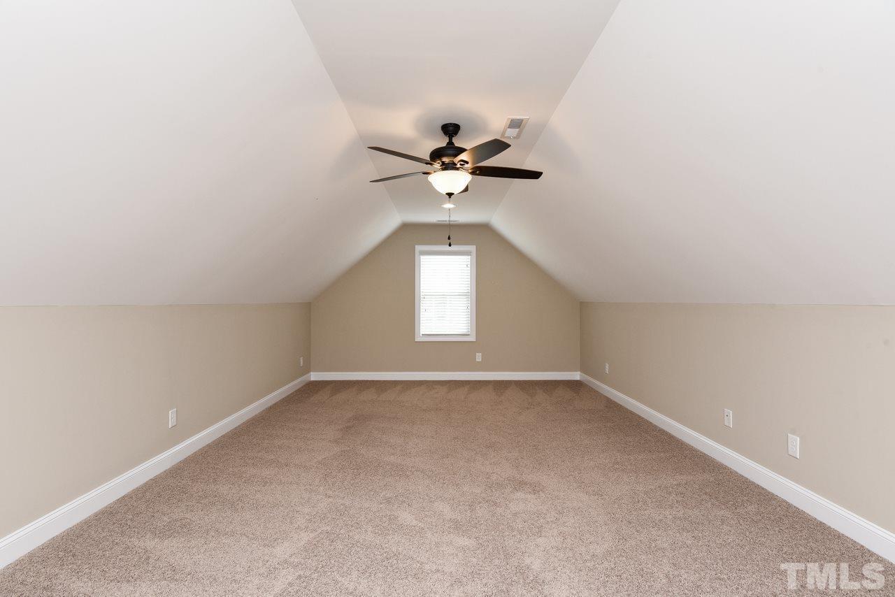43 Sharpstone Lane Clayton, NC 27527 - Photo 18 of 39 an empty room with a window and a ceiling fan