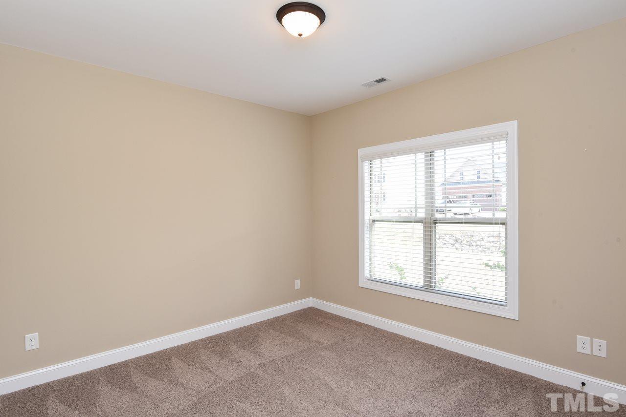 43 Sharpstone Lane Clayton, NC 27527 - Photo 20 of 39 an empty room with a window