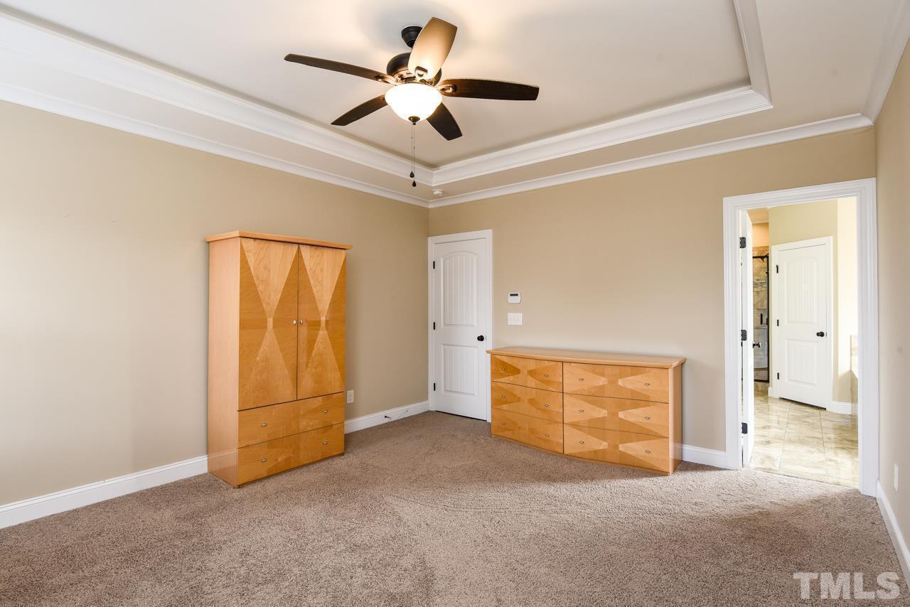 43 Sharpstone Lane Clayton, NC 27527 - Photo 24 of 39 an empty room with fan and windows