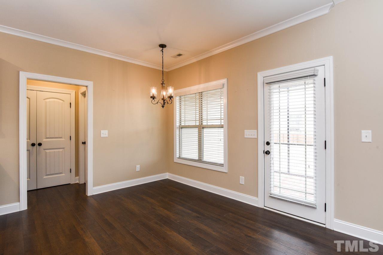 43 Sharpstone Lane Clayton, NC 27527 - Photo 25 of 39 a view of an empty room with wooden floor and a window