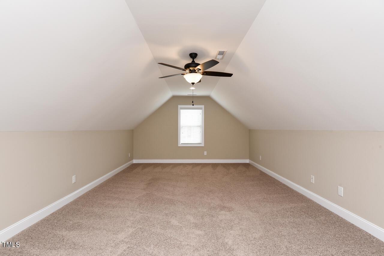 43 Sharpstone Lane Clayton, NC 27527 - Photo 31 of 39 an empty room with a window and a ceiling fan