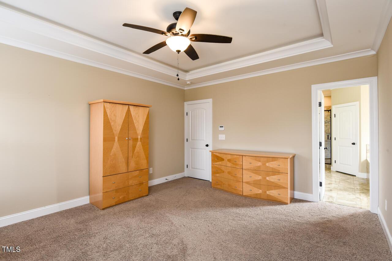 43 Sharpstone Lane Clayton, NC 27527 - Photo 37 of 39 an empty room with fan and windows