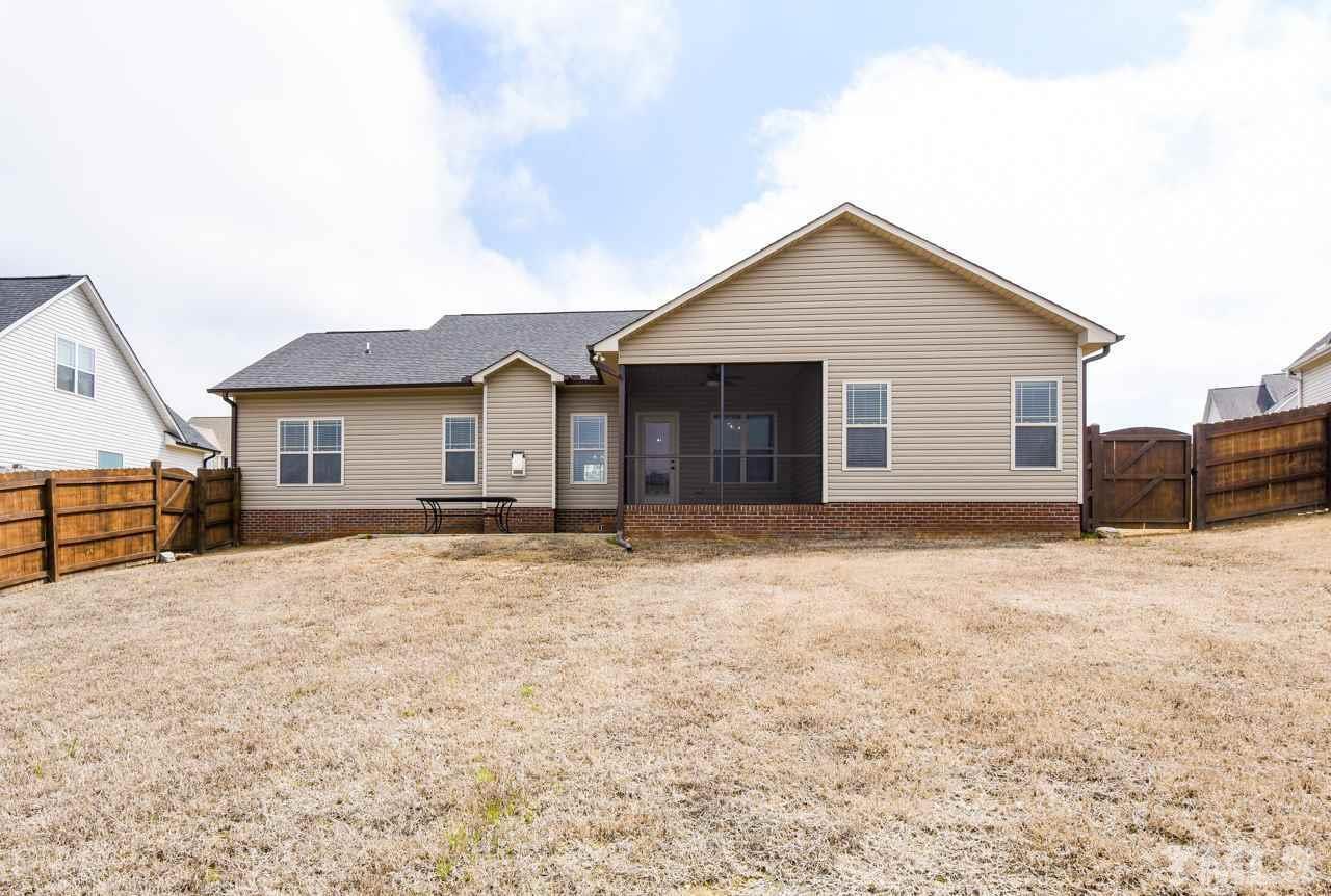 43 Sharpstone Lane Clayton, NC 27527 - Photo 5 of 39 a view of house with backyard and trees in the background