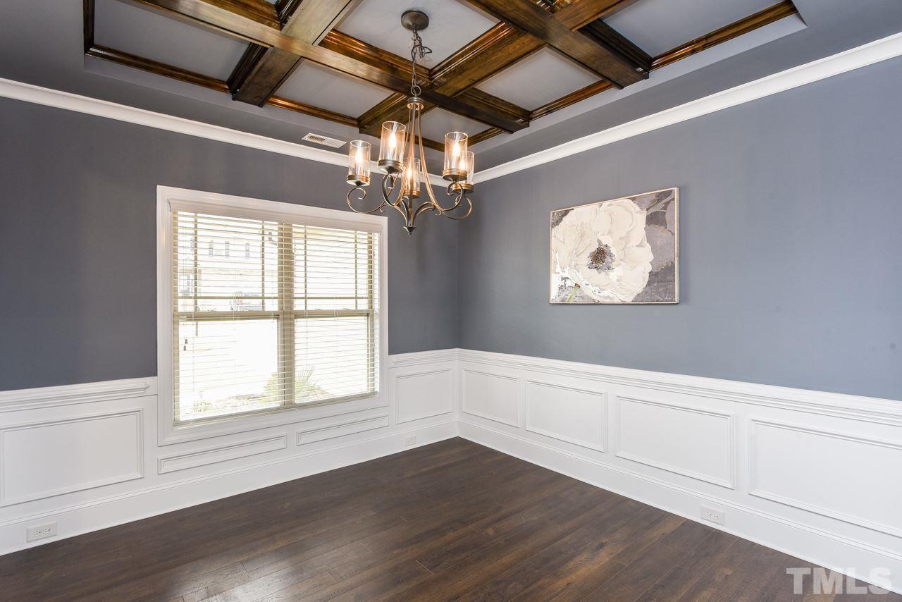 43 Sharpstone Lane Clayton, NC 27527 - Photo 10 of 39 a view of an empty room with wooden floor and a window