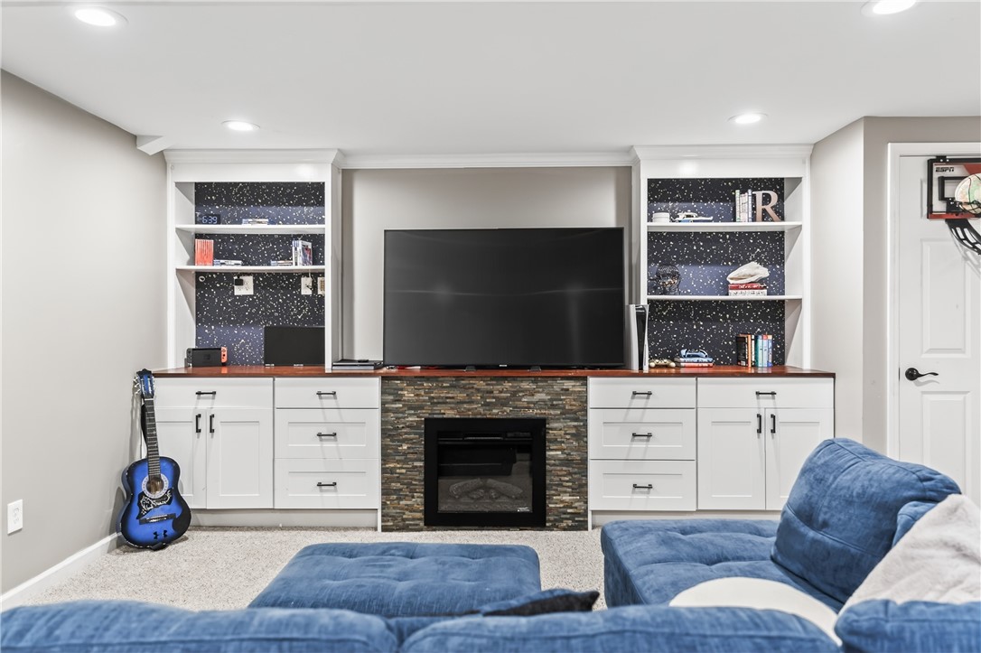 908 Taylor Rise Victor, NY 14564 - Photo 34 of 41 Built in Entertainment Center. Electric fireplace.