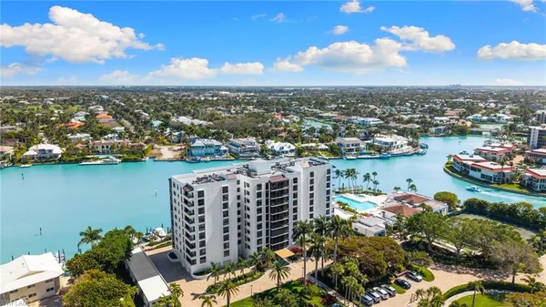 an aerial view of city and lake