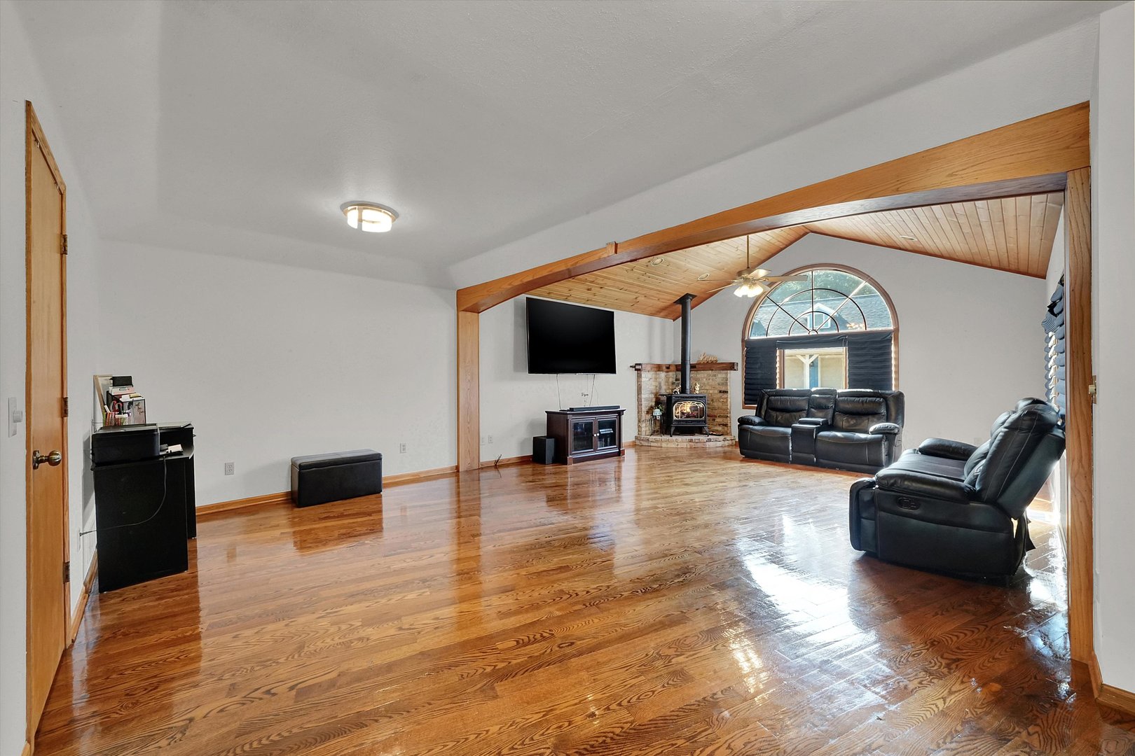6514 South Oak Grove Road Harvard, IL 60033 - Photo 12 of 51 a living room with furniture and a flat screen tv