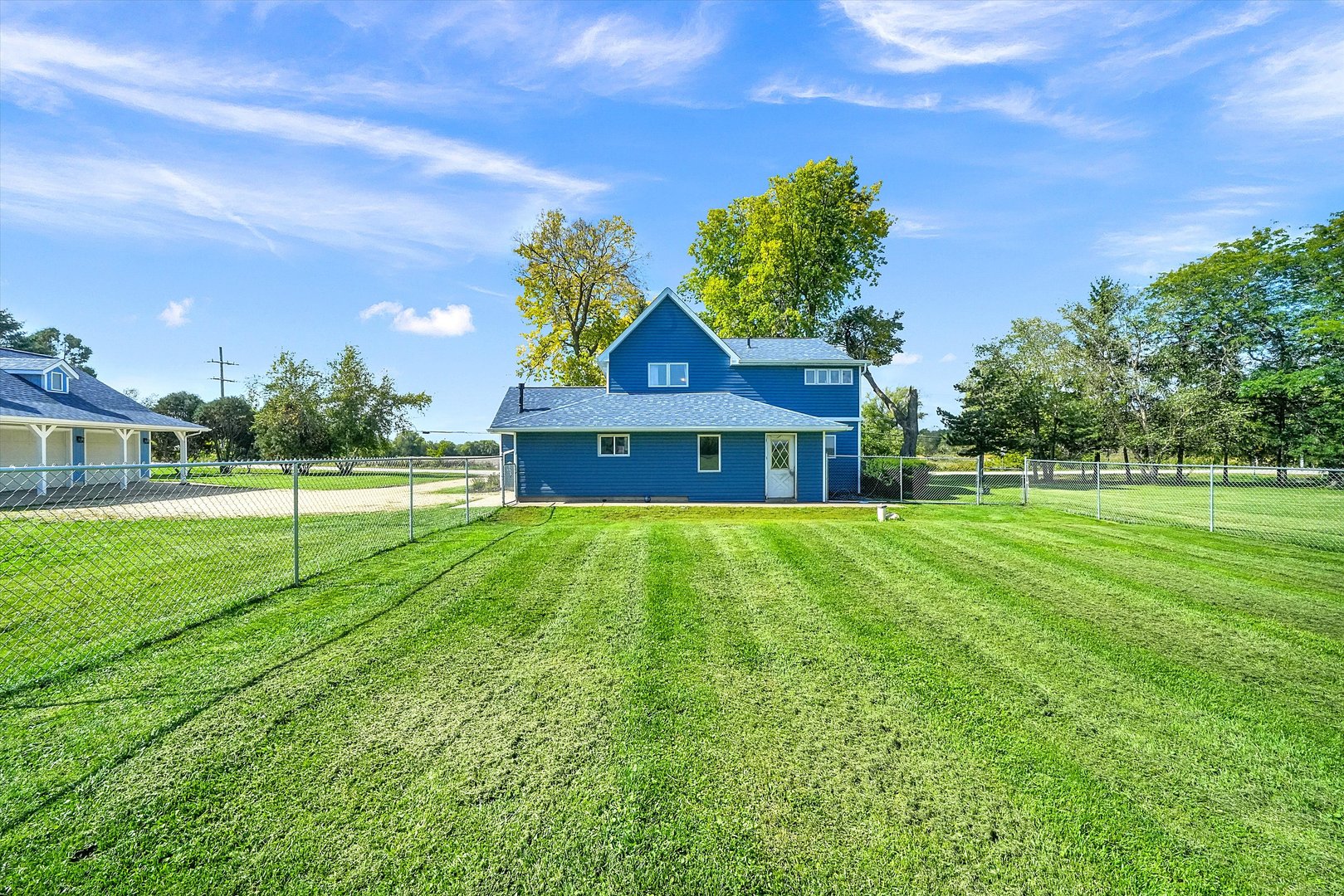 6514 South Oak Grove Road Harvard, IL 60033 - Photo 39 of 51 a view of an house with a big yard